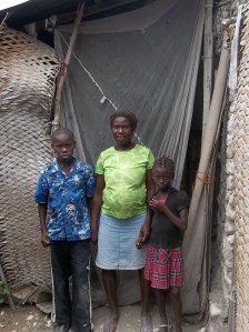 The family of some of our kids in front of their home.