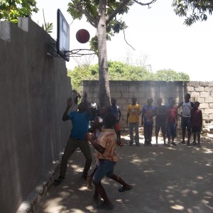 A group of kids enjoying the basketball court!